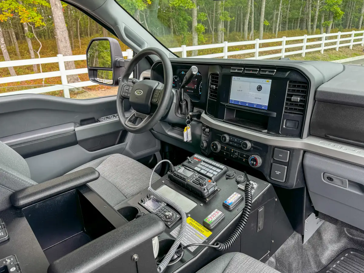 Dashboard center-stack close-up with infotainment screen and climate controls.